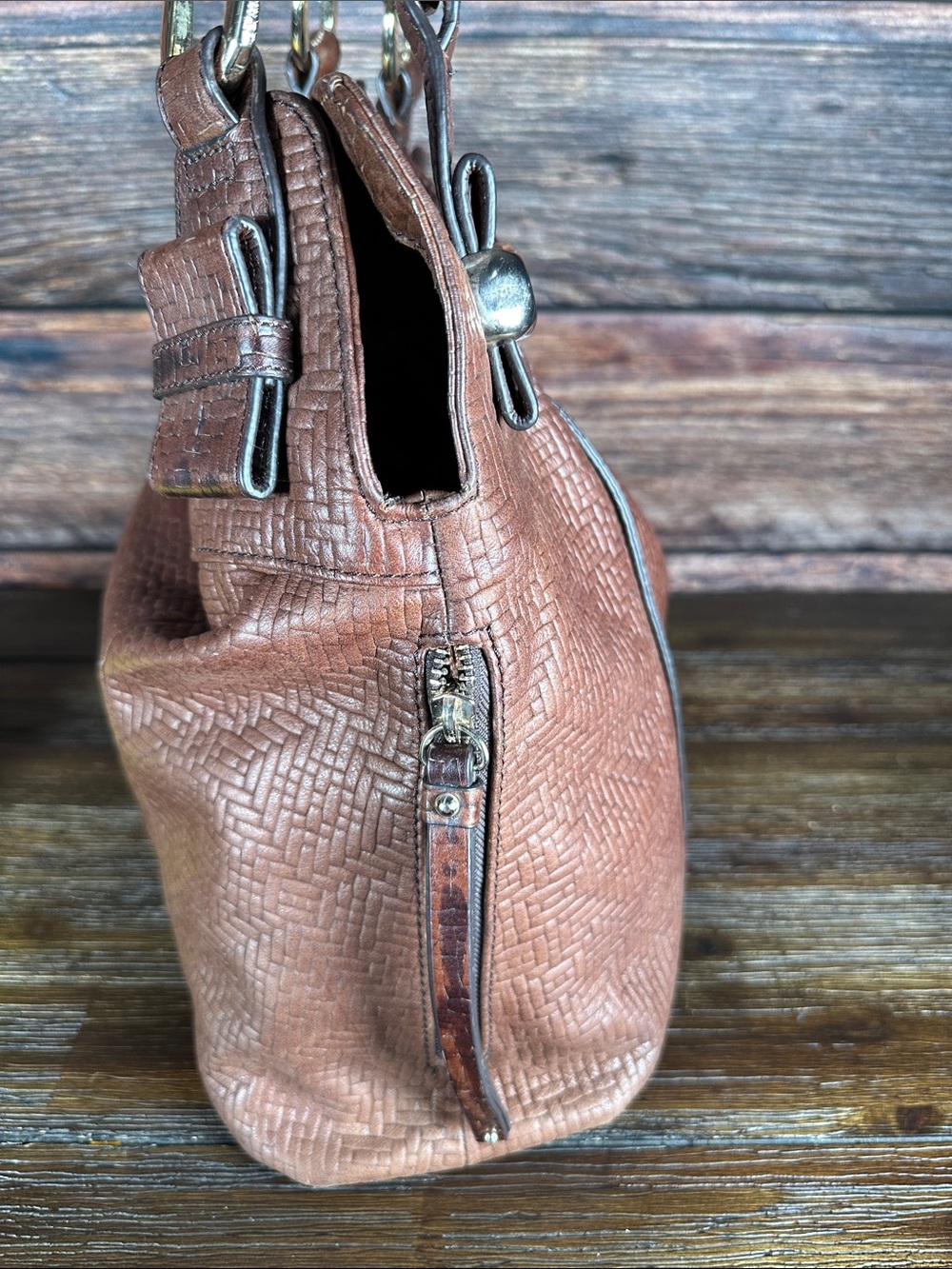 B. Makowsky brown leather shoulder bag with a textured, woven embossed pattern. - Picture 5 of 10